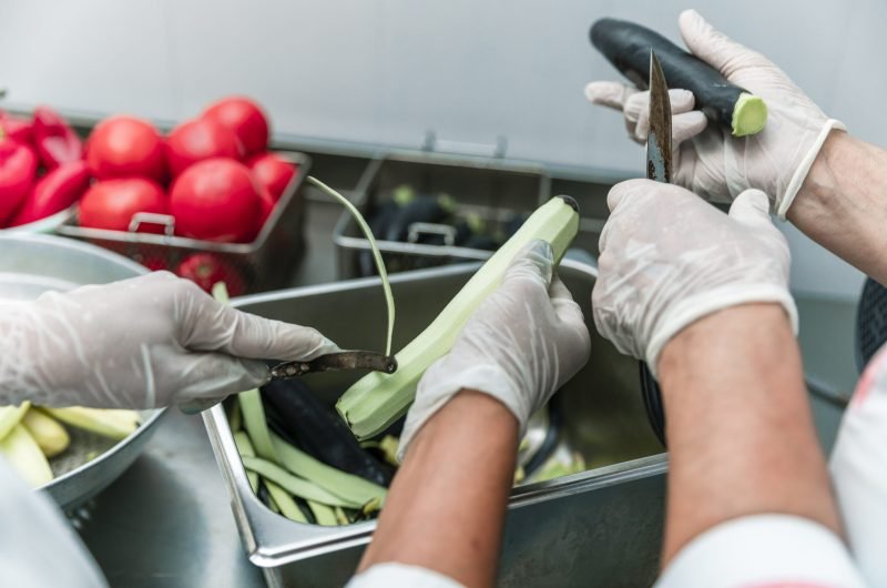 Peeling or cutting vegetables in the kitchen. High quality photo